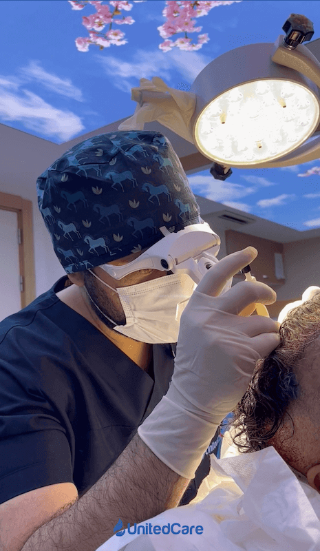 Dr. K performing DHI unshaven hair transplant 